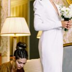 Adjustments - Woman Making Adjustments to Brides Wedding Dress