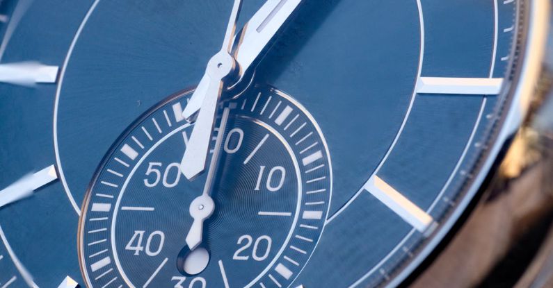 Time Audits - A close up of a blue wrist watch