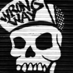 Quick Wins - Funky skull graffiti on locked roll down black door